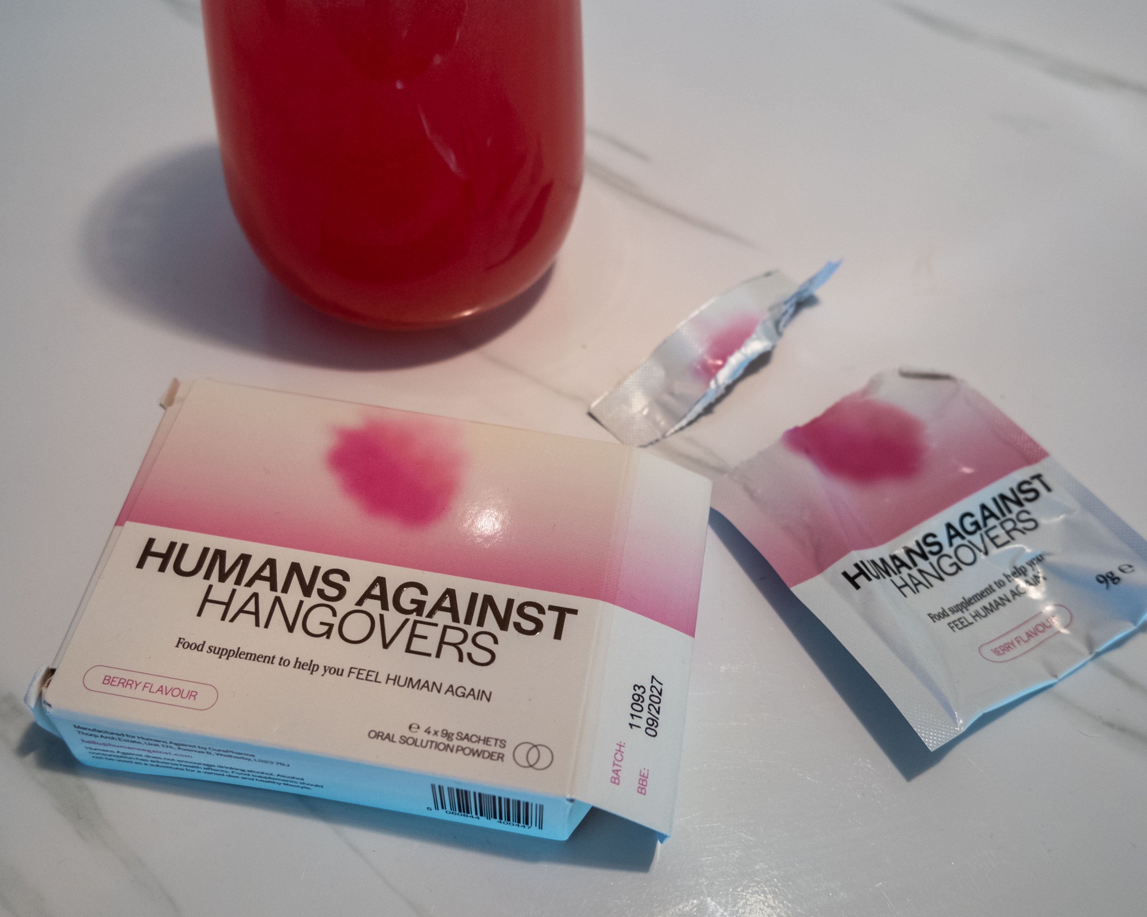 An opened sachet of Humans Against Hangovers on the bedside table